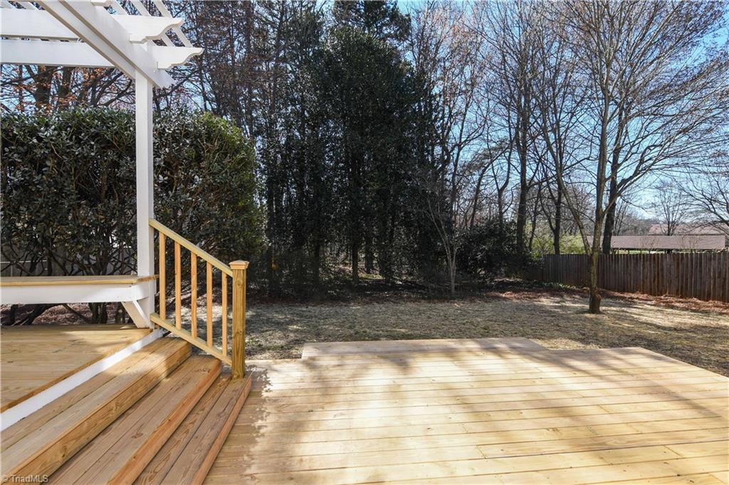 3703 Pinetop Road Greensboro, NC 27410 - Photo 28 of 30 Big 2 level deck with fenced back yard