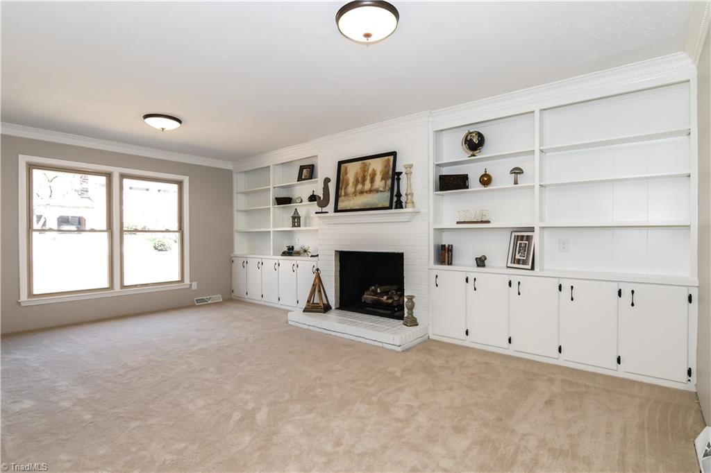 3703 Pinetop Road Greensboro, NC 27410 - Photo 10 of 30 Spacious Den with a Gas log Fire place and beautiful Built-ins!