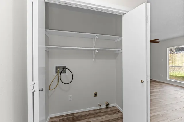 a bathroom with a toilet and a window