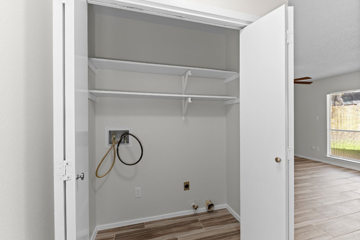 10807 Lambert Circle, Unit A Austin, TX 78758 - Photo 24 of 39 a bathroom with a toilet and a window