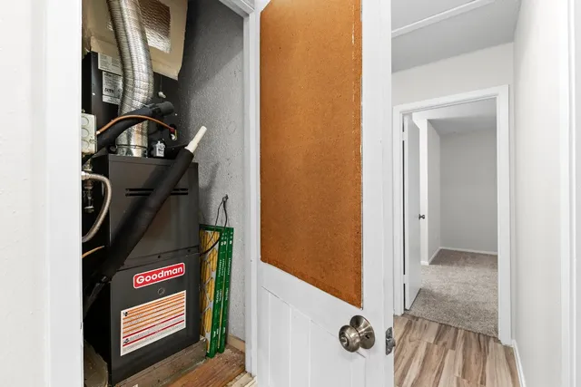 a view of hallway with wooden floor