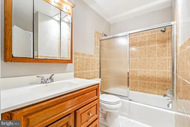 a bathroom with a sink a toilet and a bathtub