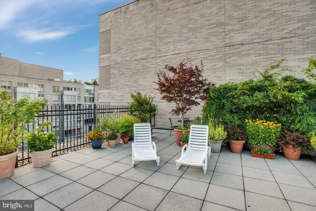 a view of a chairs and table in the patio