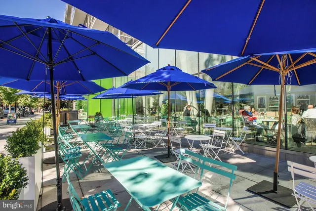 a view of a table and chairs under an umbrella