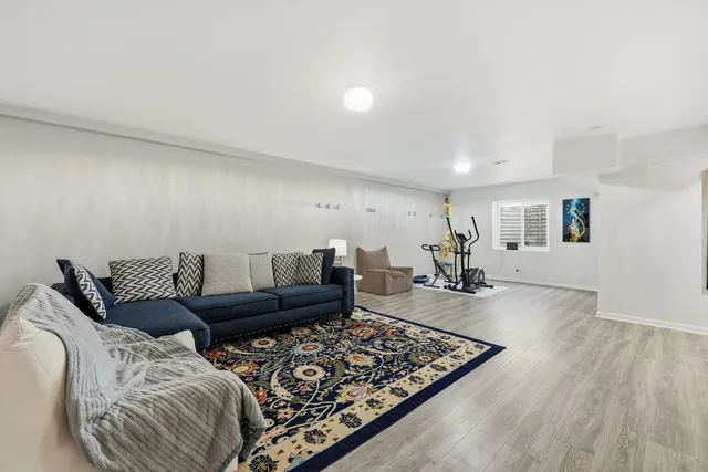 a view of a kitchen with a sink and a refrigerator