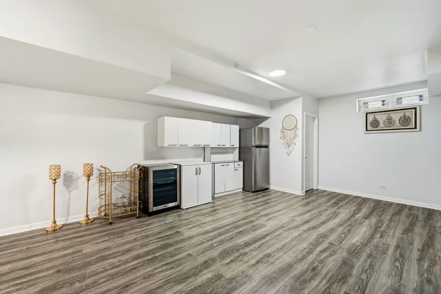 a bathroom with a toilet sink and shower