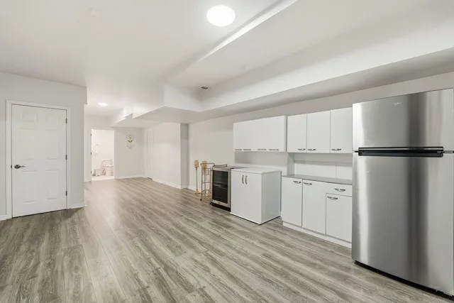 a bedroom with two beds and a desk