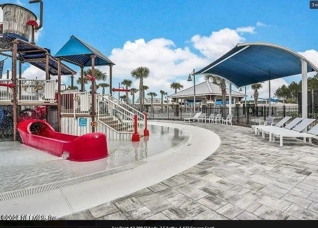a view of swimming pool with outdoor seating and yard