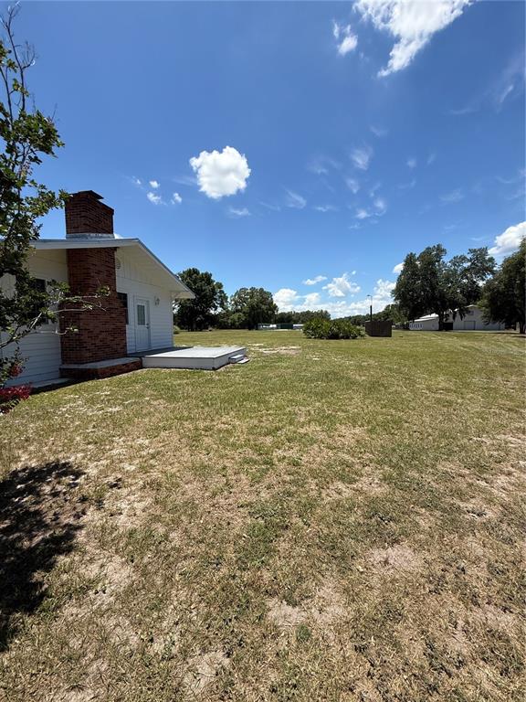 7390 South Mc Alpin Road McAlpin, FL 32062 - Photo 41 of 53 a view of a room with a kitchen space and a lake view