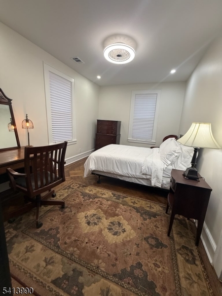 794 Lake Street Newark, NJ 07104 - Photo 5 of 9 a bedroom with a bed window and chair
