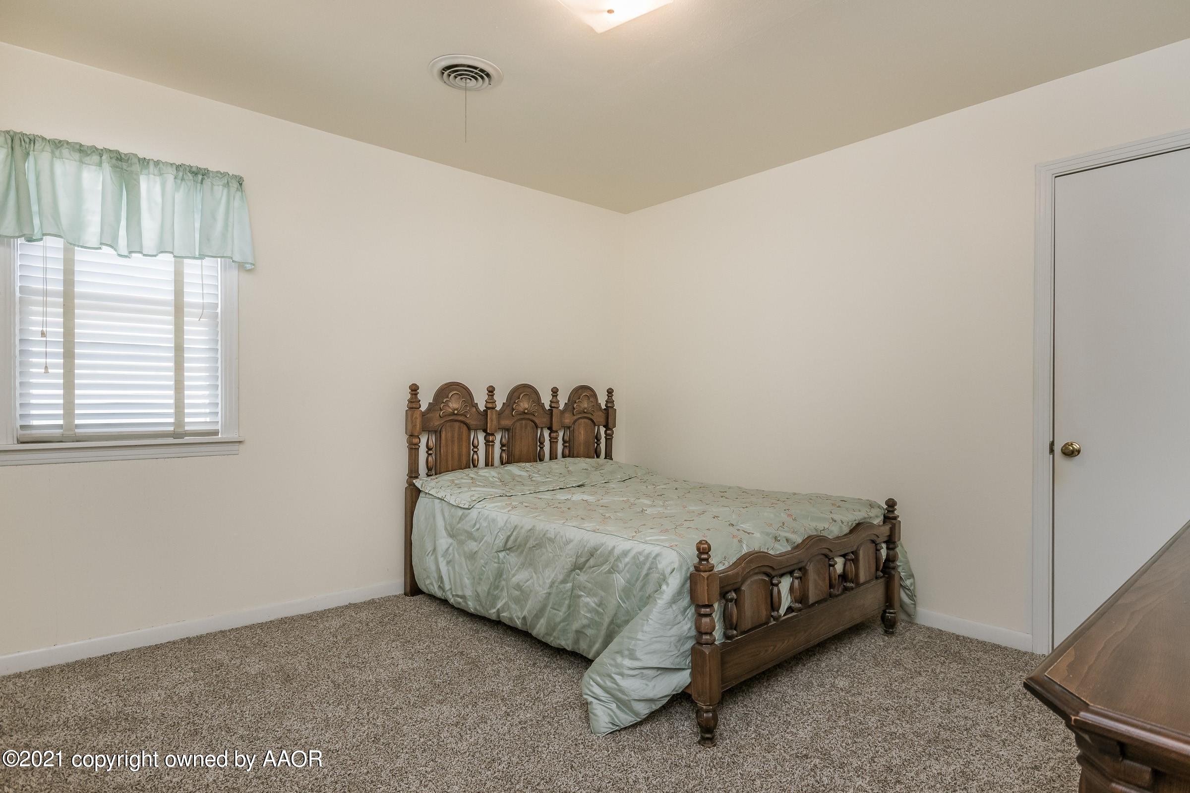 4412 South Lipscomb Street Amarillo, TX 79110 - Photo 12 of 18 a bedroom with a bed and a window