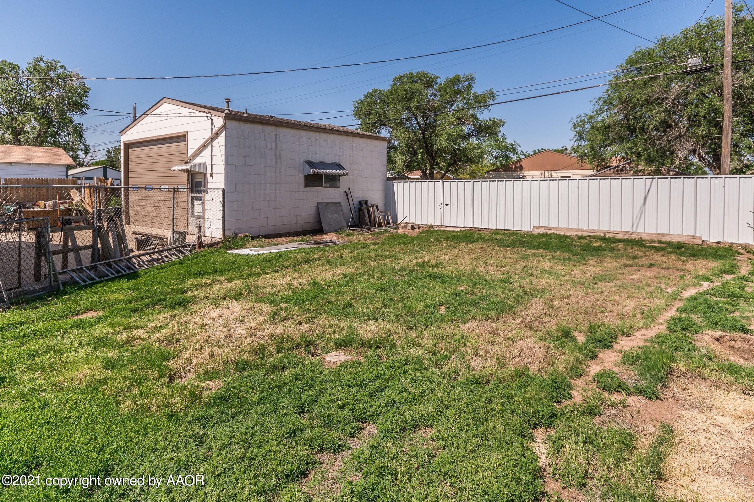 4412 South Lipscomb Street Amarillo, TX 79110 - Photo 16 of 18 a view of a backyard with a garden and tree