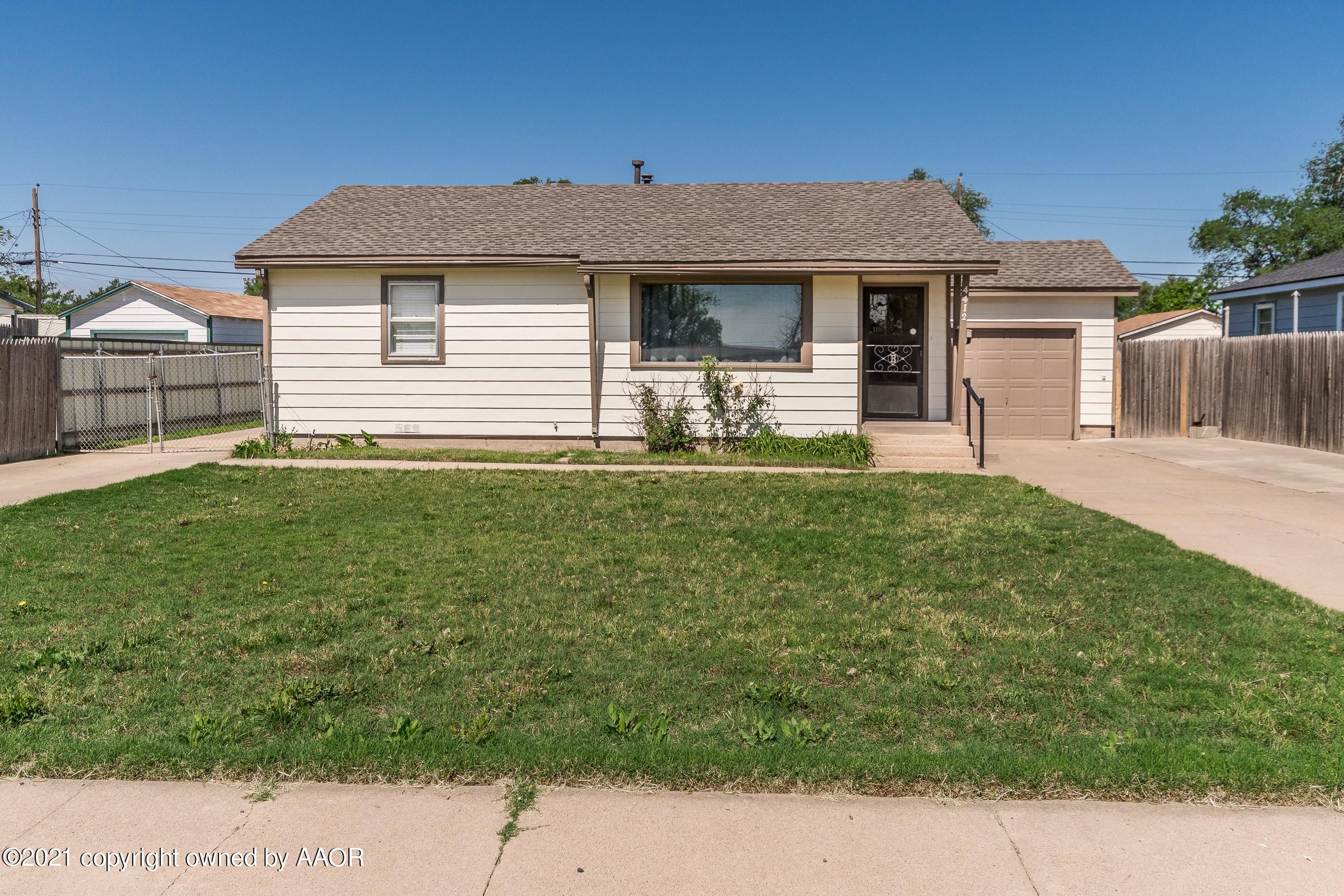 4412 South Lipscomb Street Amarillo, TX 79110 - Photo 2 of 18 a front view of a house with a yard