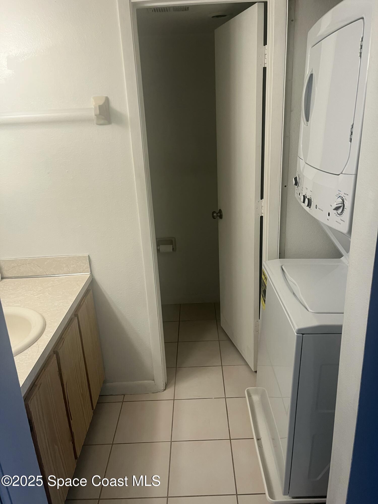 1624 Sunny Brook Lane, Unit C203 Palm Bay, FL 32905 - Photo 16 of 16 a bathroom with a sink and a vanity