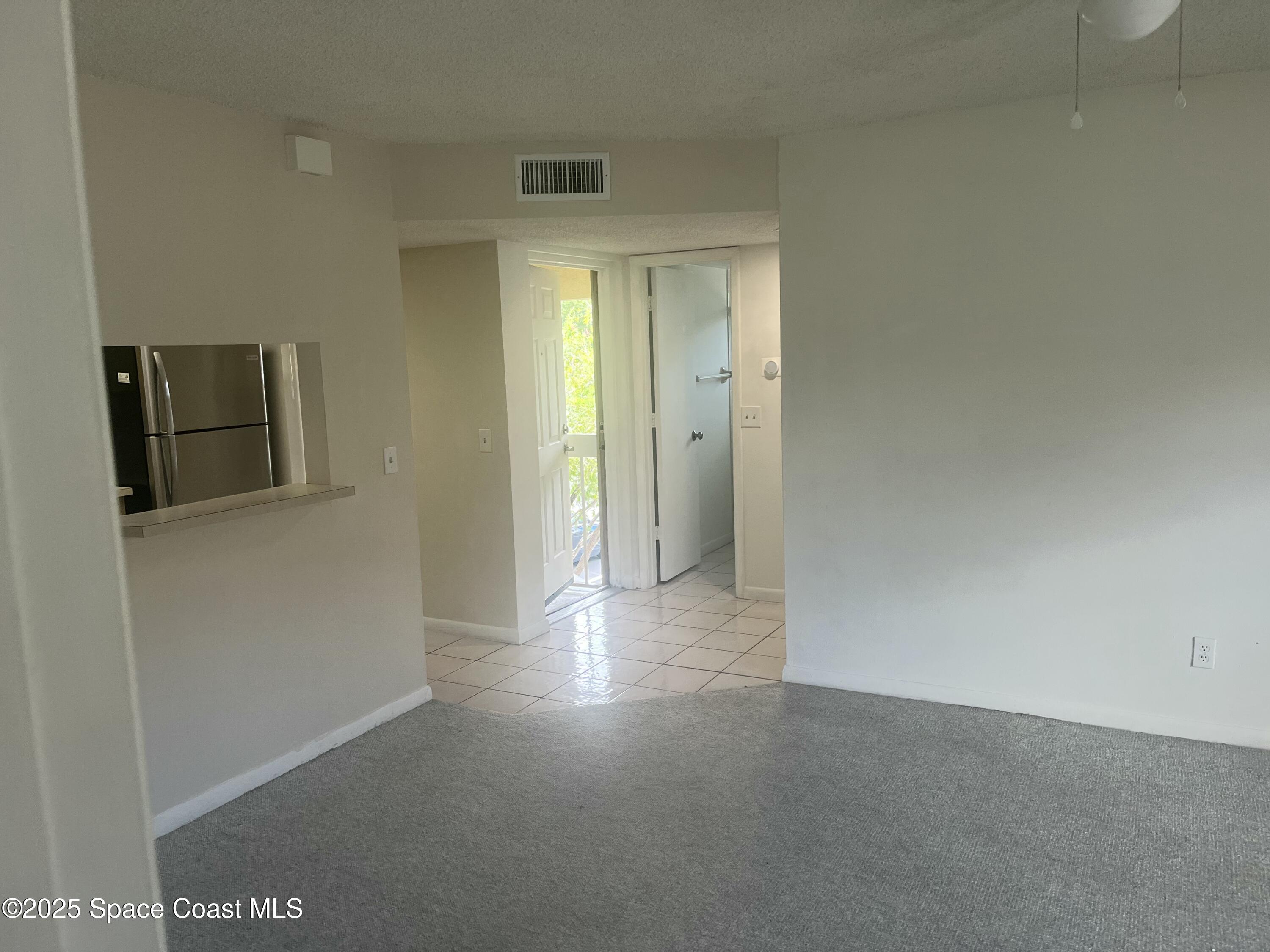 1624 Sunny Brook Lane, Unit C203 Palm Bay, FL 32905 - Photo 4 of 16 a view of a hallway
