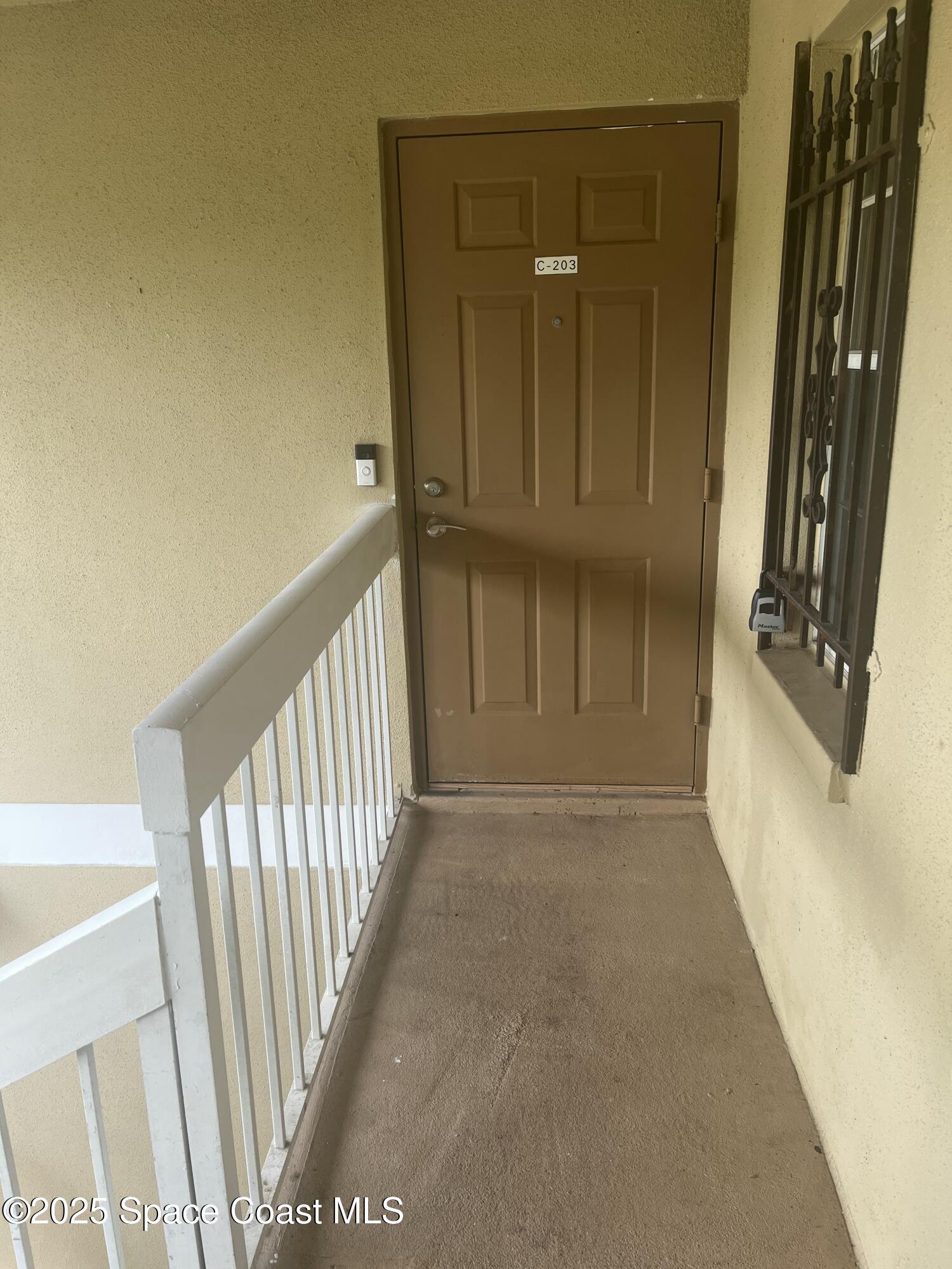 1624 Sunny Brook Lane, Unit C203 Palm Bay, FL 32905 - Photo 8 of 16 a view of a hallway