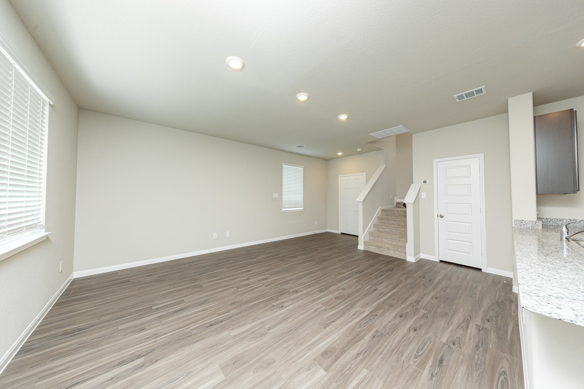 13663 Kit Run Splendora, TX 77372 - Photo 5 of 28 a view of empty room with wooden floor and window