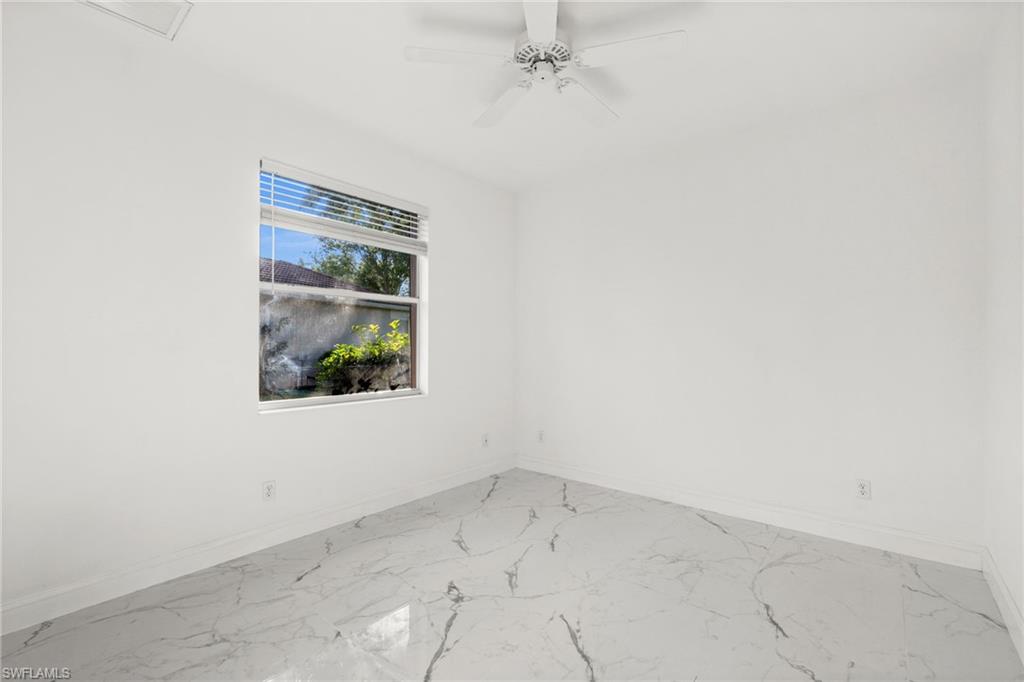 3972 Ruxton Road Naples, FL 34116 - Photo 27 of 41 an empty room with a window
