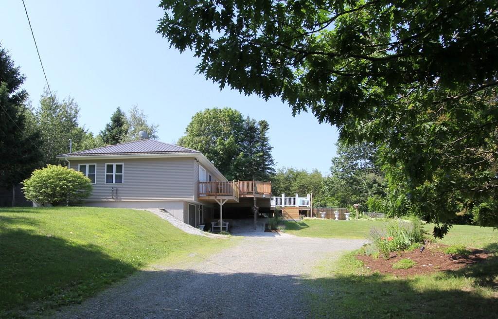 647 Wiswell Road Holden, ME 04429 - Photo 1 of 35 Beautifully landscaped lot!