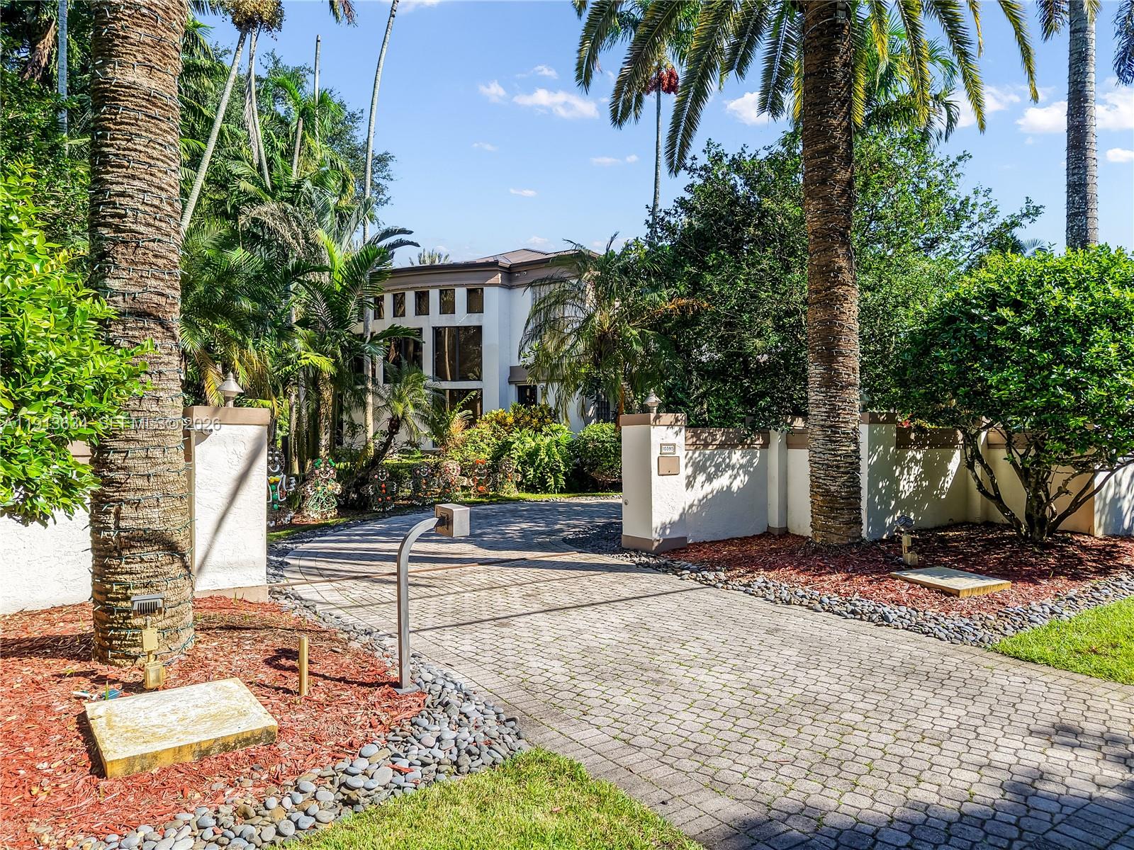10395 Southwest 67th Avenue Pinecrest, FL 33156 - Photo 15 of 94 a house with trees in front of it