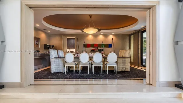 a living room with furniture a window and a flat screen tv