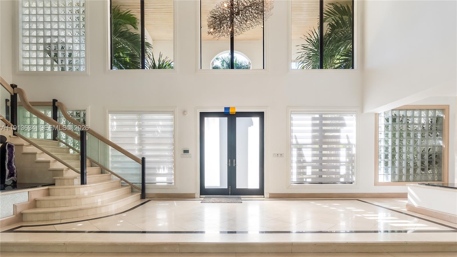 10395 Southwest 67th Avenue Pinecrest, FL 33156 - Photo 31 of 94 a view of an entryway with wooden floor