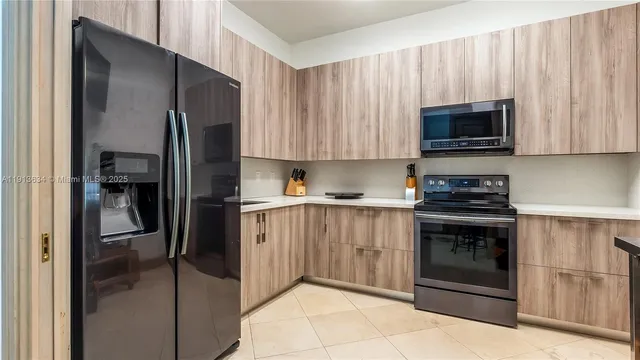 a room with wooden floor table and chairs