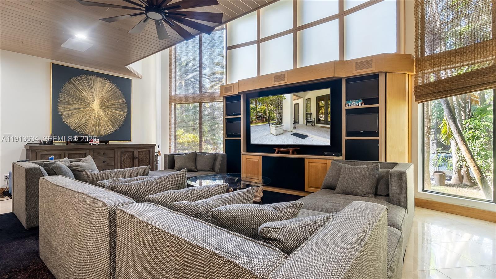 10395 Southwest 67th Avenue Pinecrest, FL 33156 - Photo 46 of 94 a living room with furniture and a large window