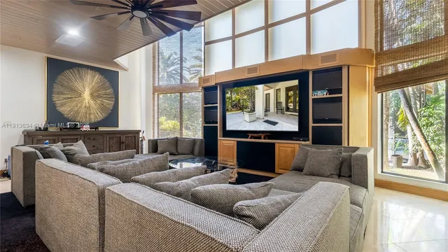 a view of a house with pool and sitting area
