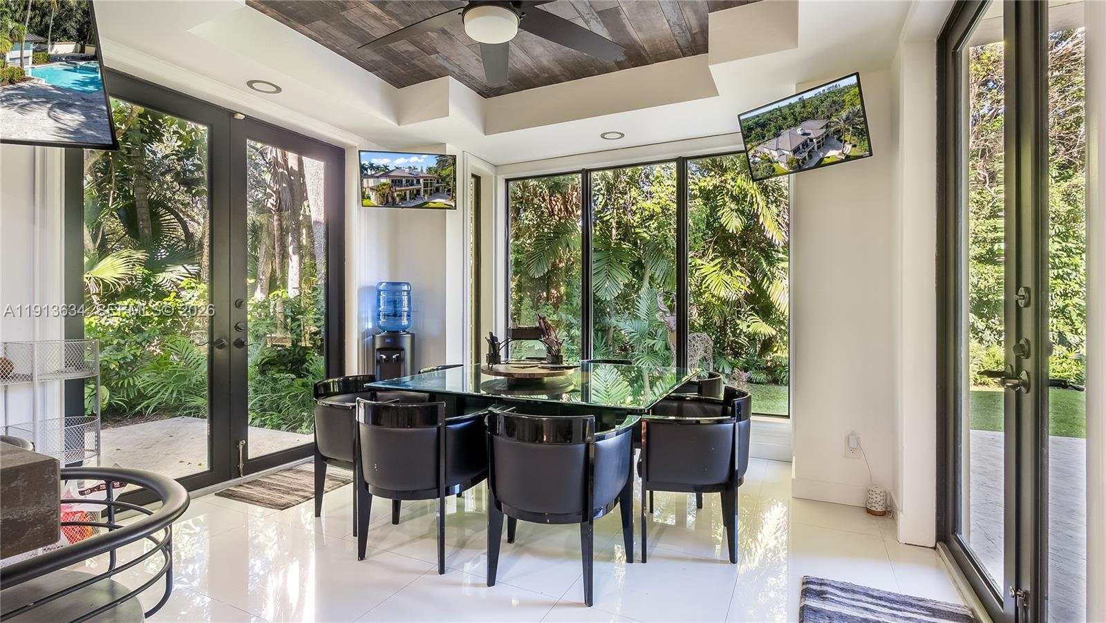 10395 Southwest 67th Avenue Pinecrest, FL 33156 - Photo 57 of 94 a dining room with furniture and window
