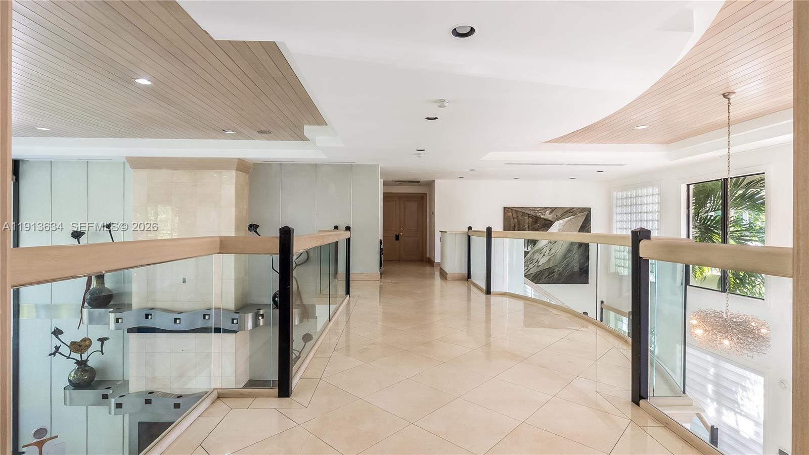 10395 Southwest 67th Avenue Pinecrest, FL 33156 - Photo 63 of 94 a view of a living room and a large window