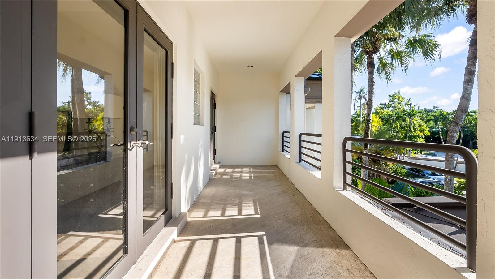 10395 Southwest 67th Avenue Pinecrest, FL 33156 - Photo 70 of 94 a view of a balcony with wooden floor and outdoor space