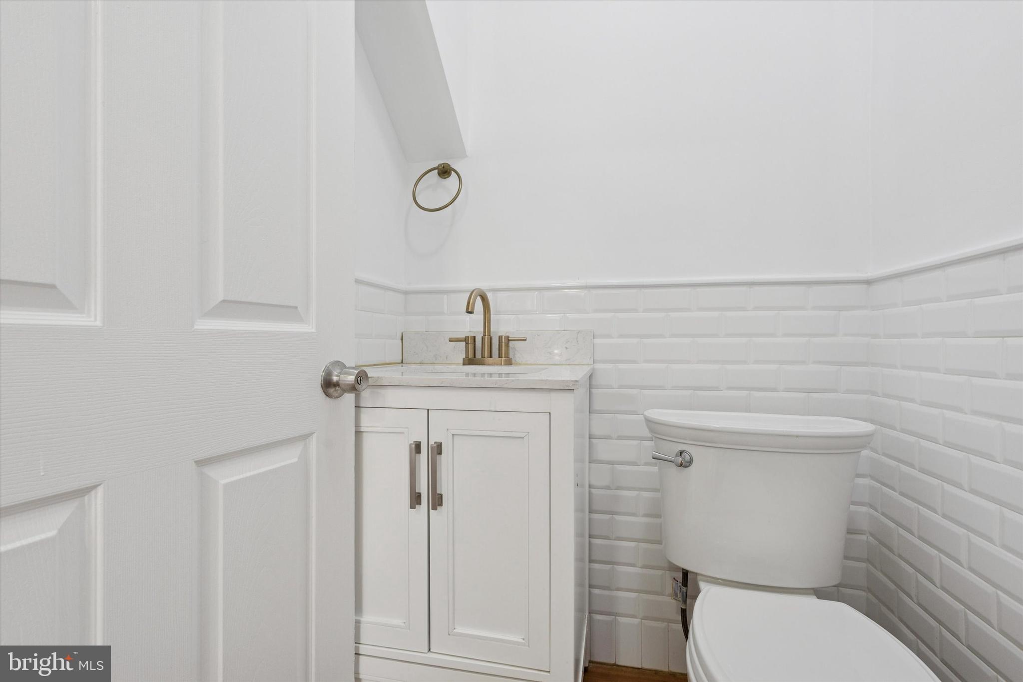 226 Upland Road Merion Station, PA 19066 - Photo 16 of 30 a bathroom with a toilet sink and mirror