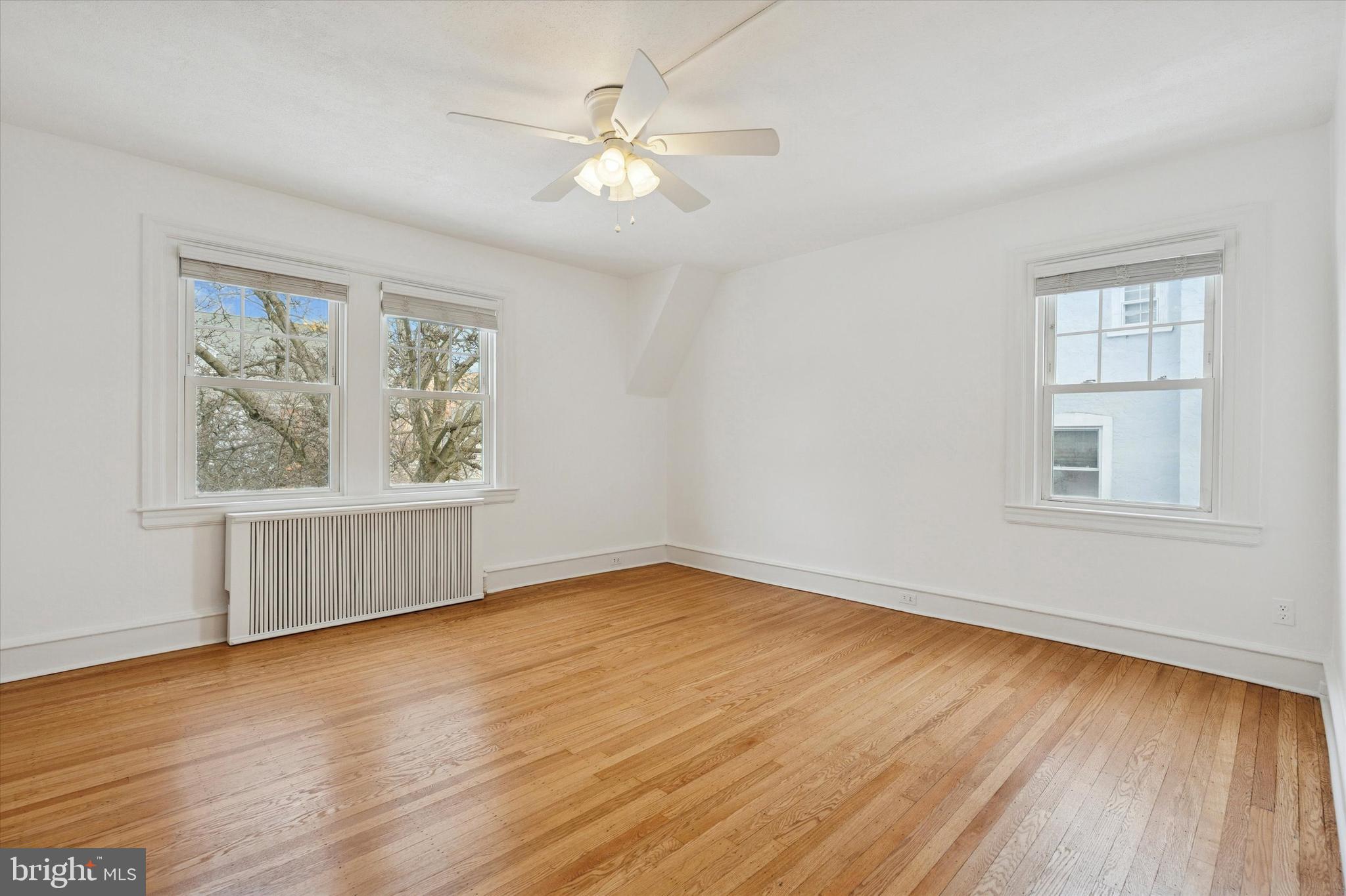 226 Upland Road Merion Station, PA 19066 - Photo 22 of 30 wooden floor in an empty room with a window