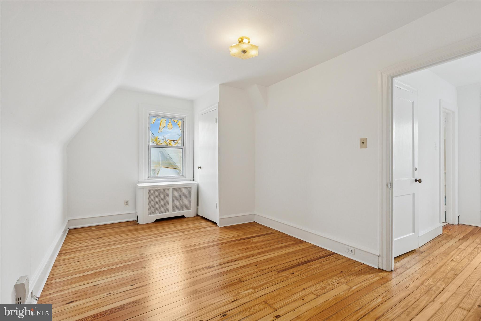 226 Upland Road Merion Station, PA 19066 - Photo 24 of 30 a view of empty room with wooden floor and fan