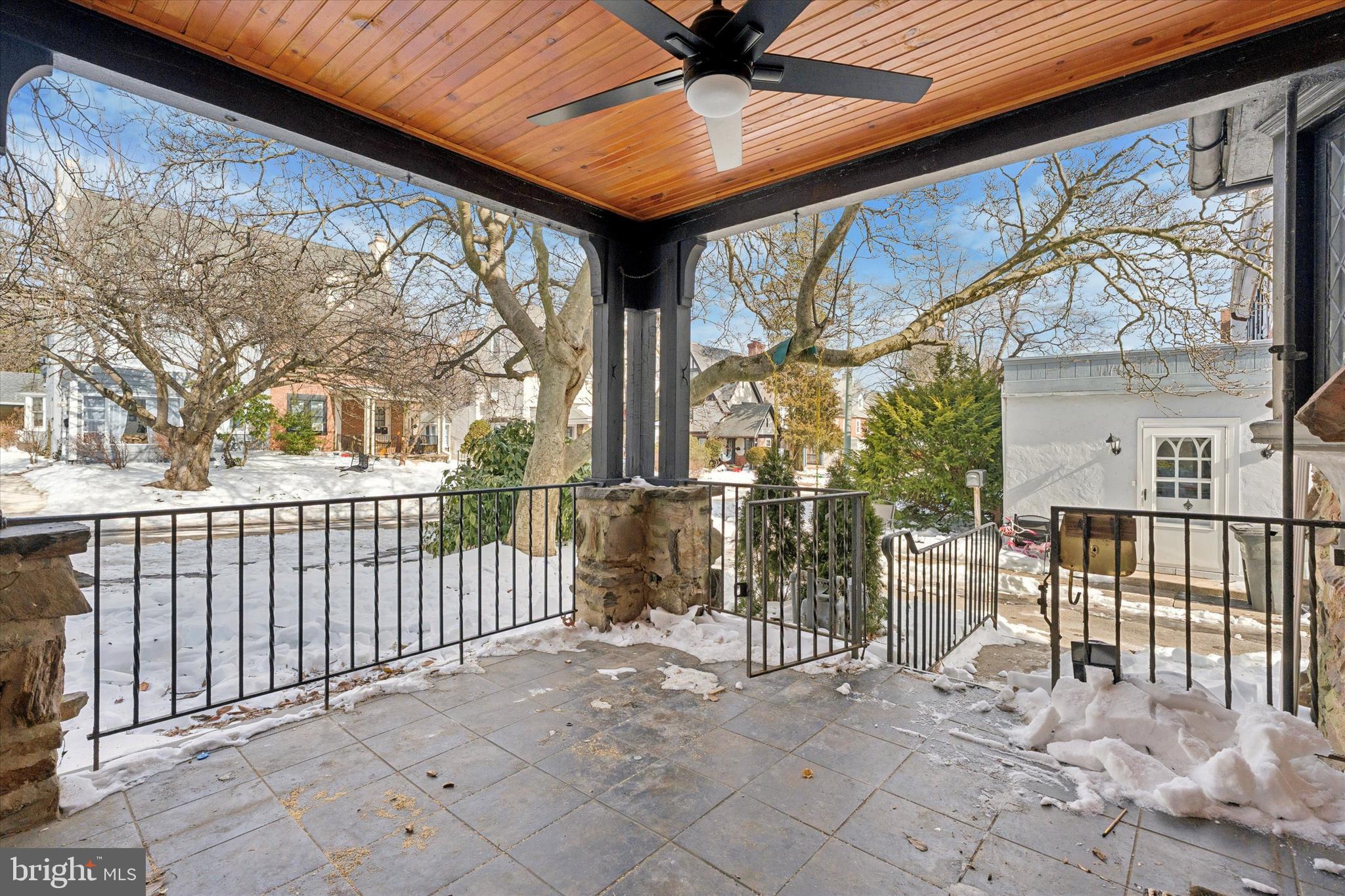226 Upland Road Merion Station, PA 19066 - Photo 3 of 30 a view of a porch with wooden floor and fence
