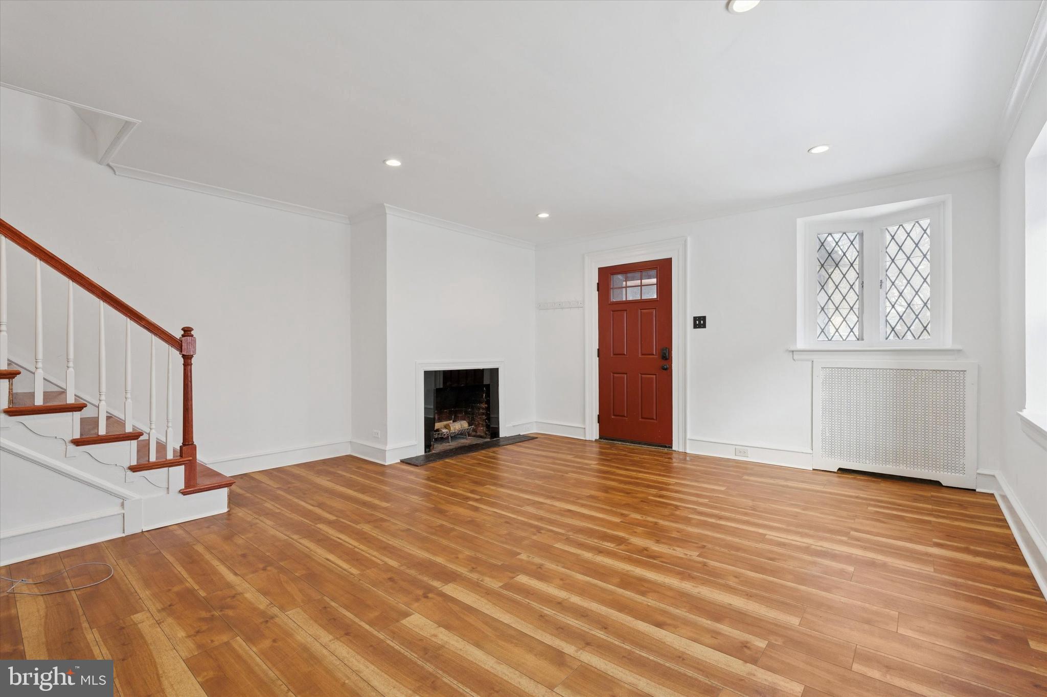 226 Upland Road Merion Station, PA 19066 - Photo 7 of 30 a view of an empty room with wooden floor and a window