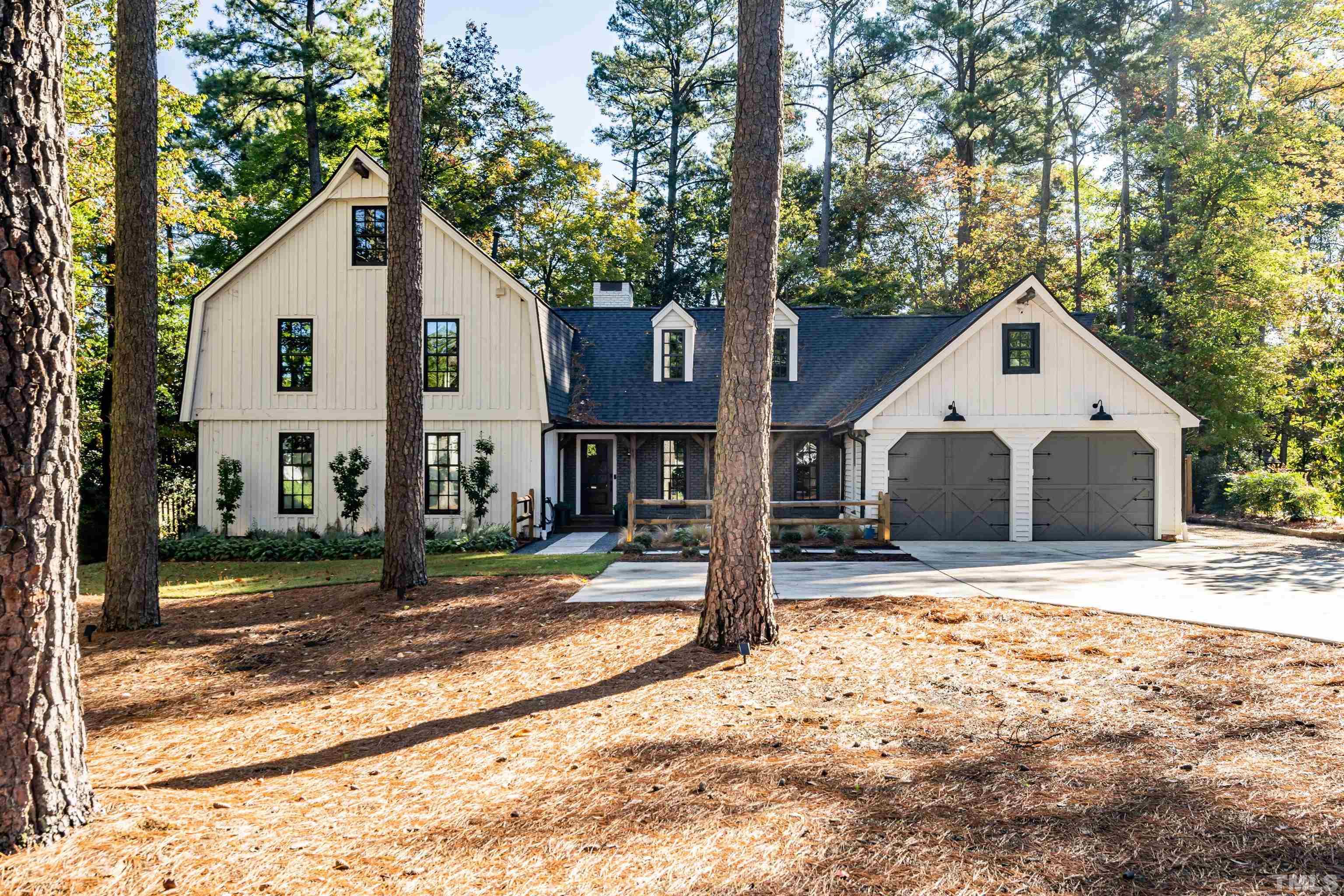 2412 Ridge Road Raleigh, NC 27612 - Photo 1 of 43 a front view of a house with a yard and garage