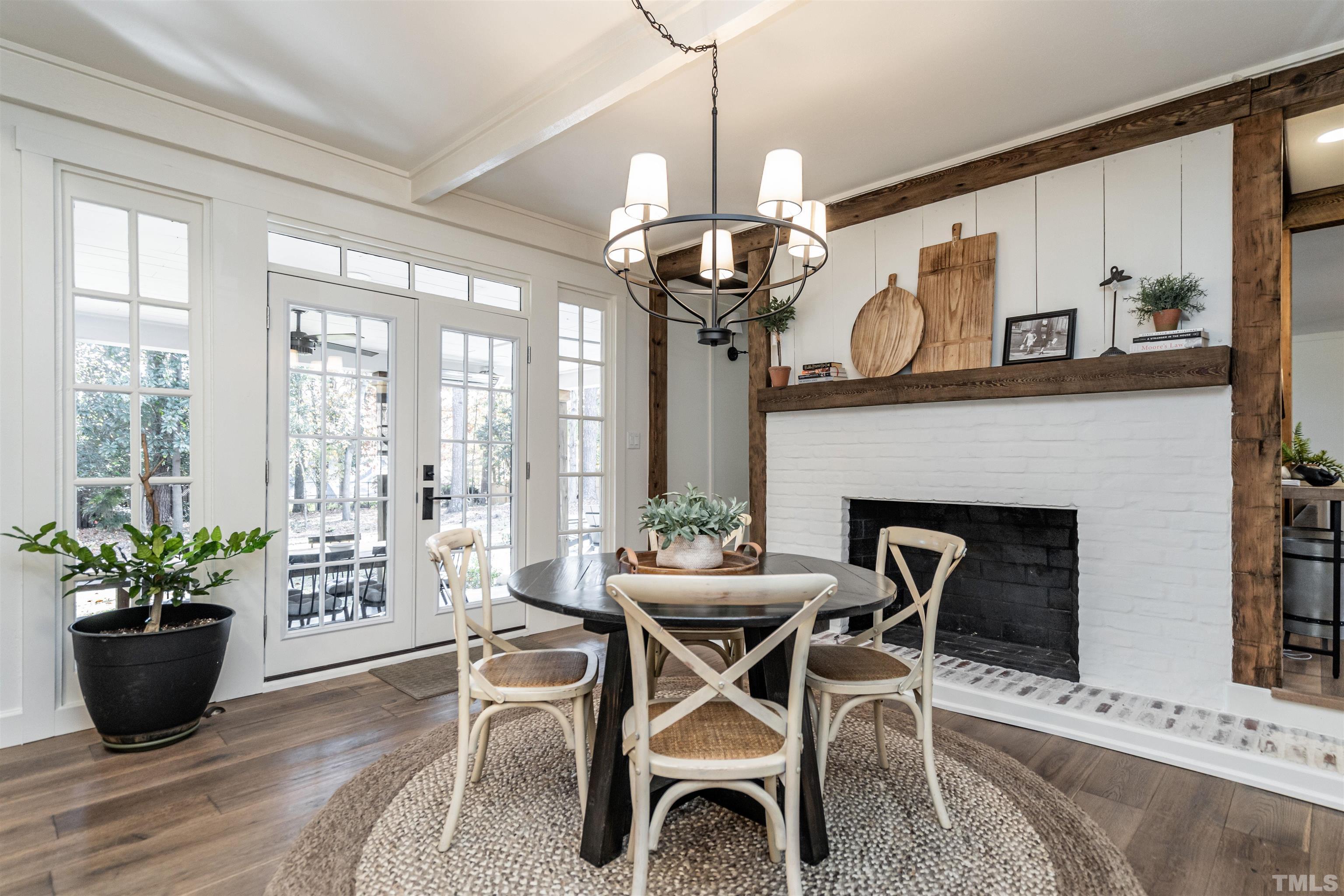 2412 Ridge Road Raleigh, NC 27612 - Photo 12 of 43 a view of a dining room with furniture window and wooden floor