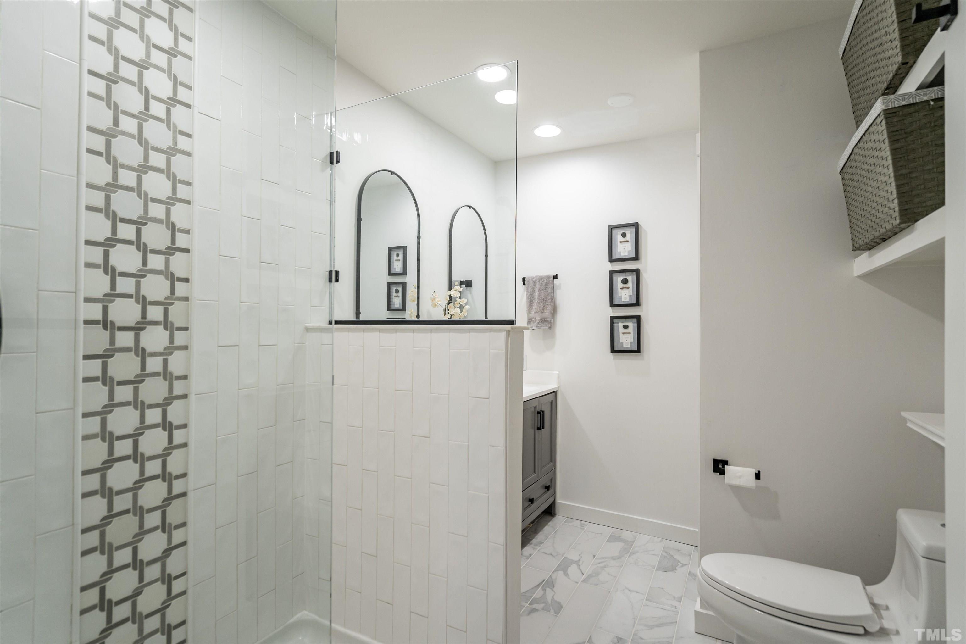 2412 Ridge Road Raleigh, NC 27612 - Photo 22 of 43 a bathroom with a toilet sink and shower