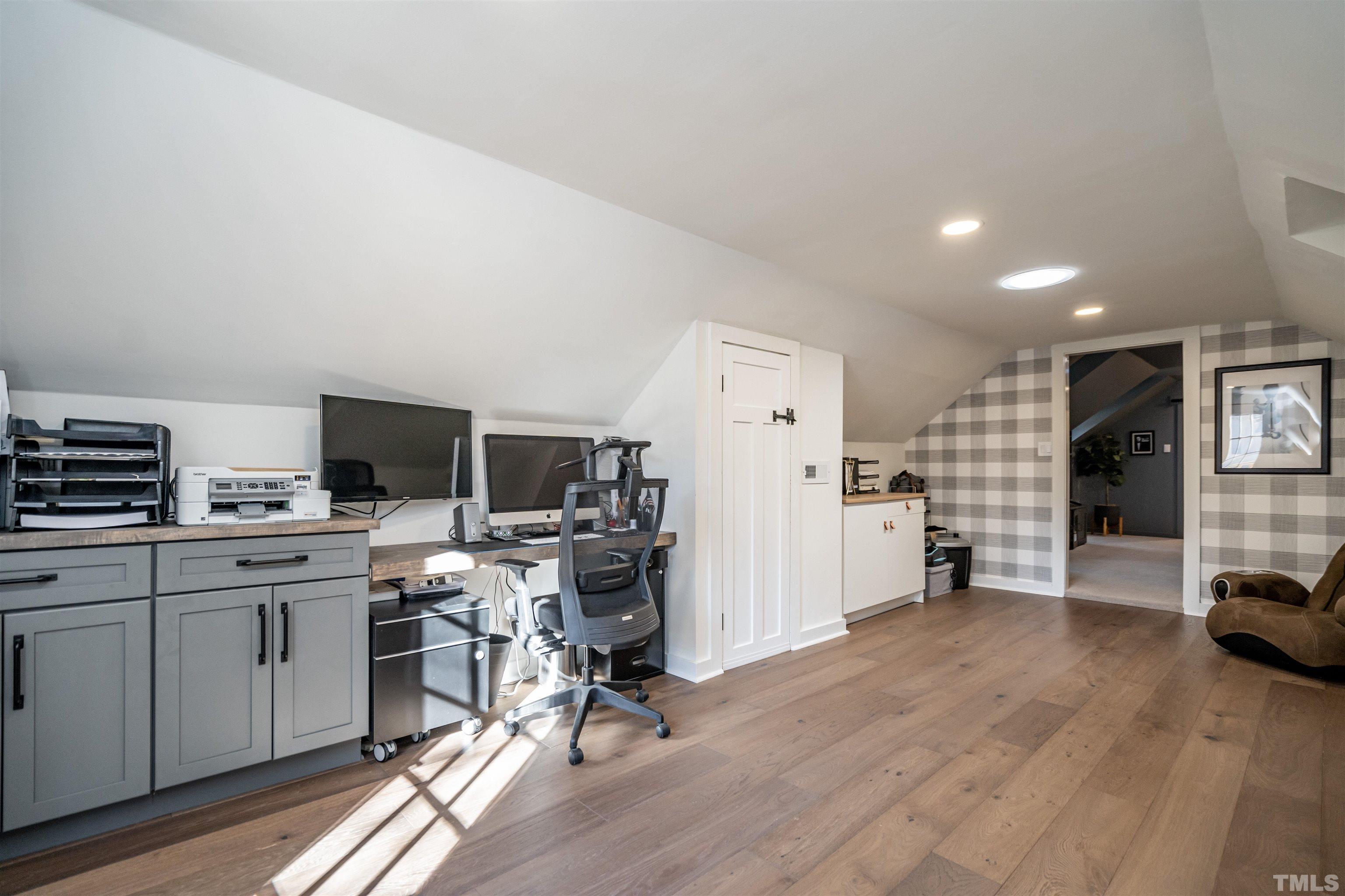 2412 Ridge Road Raleigh, NC 27612 - Photo 28 of 43 a view of a livingroom with workspace and a window