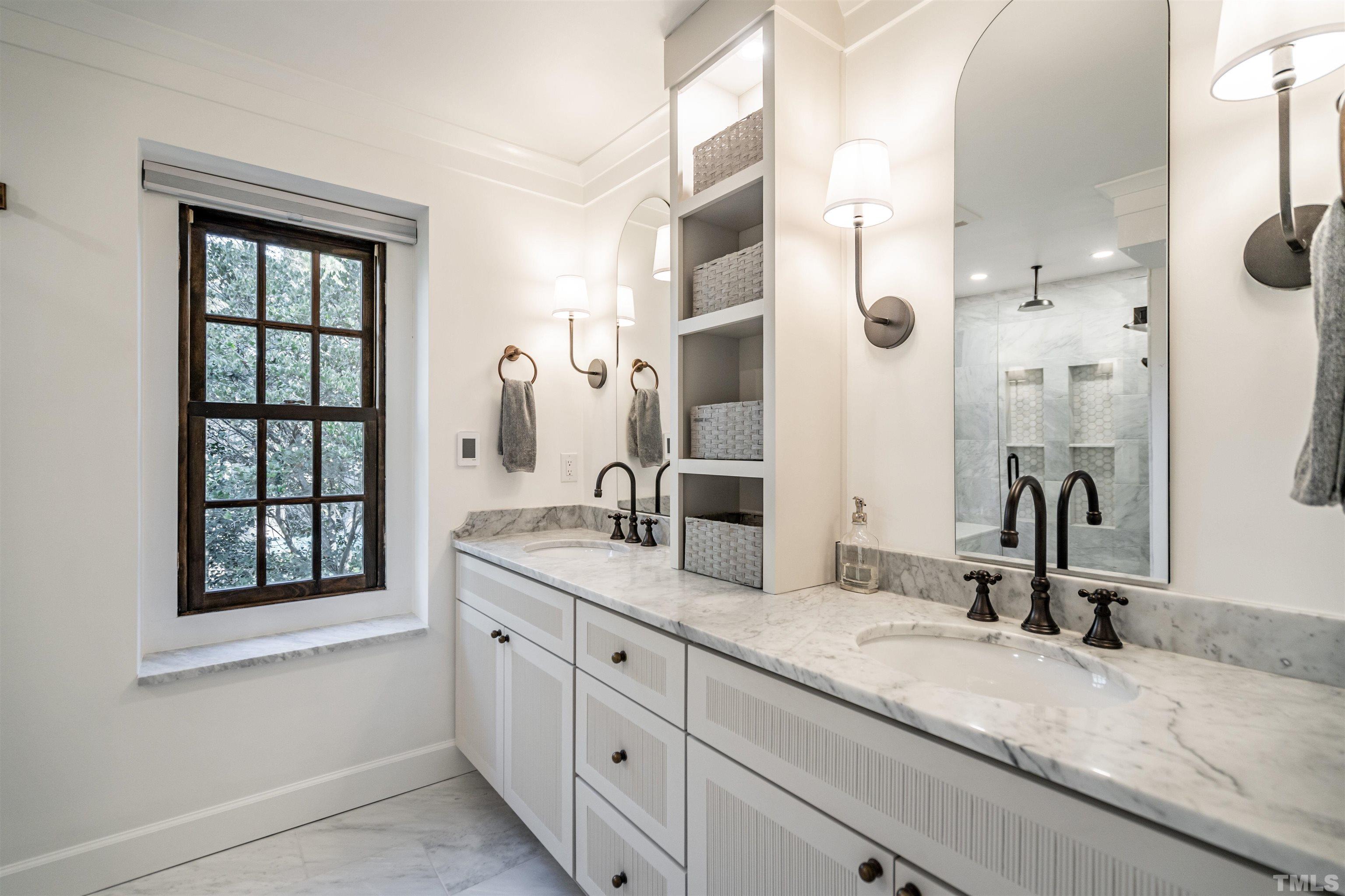2412 Ridge Road Raleigh, NC 27612 - Photo 30 of 43 a bathroom with a granite countertop sink mirror and double