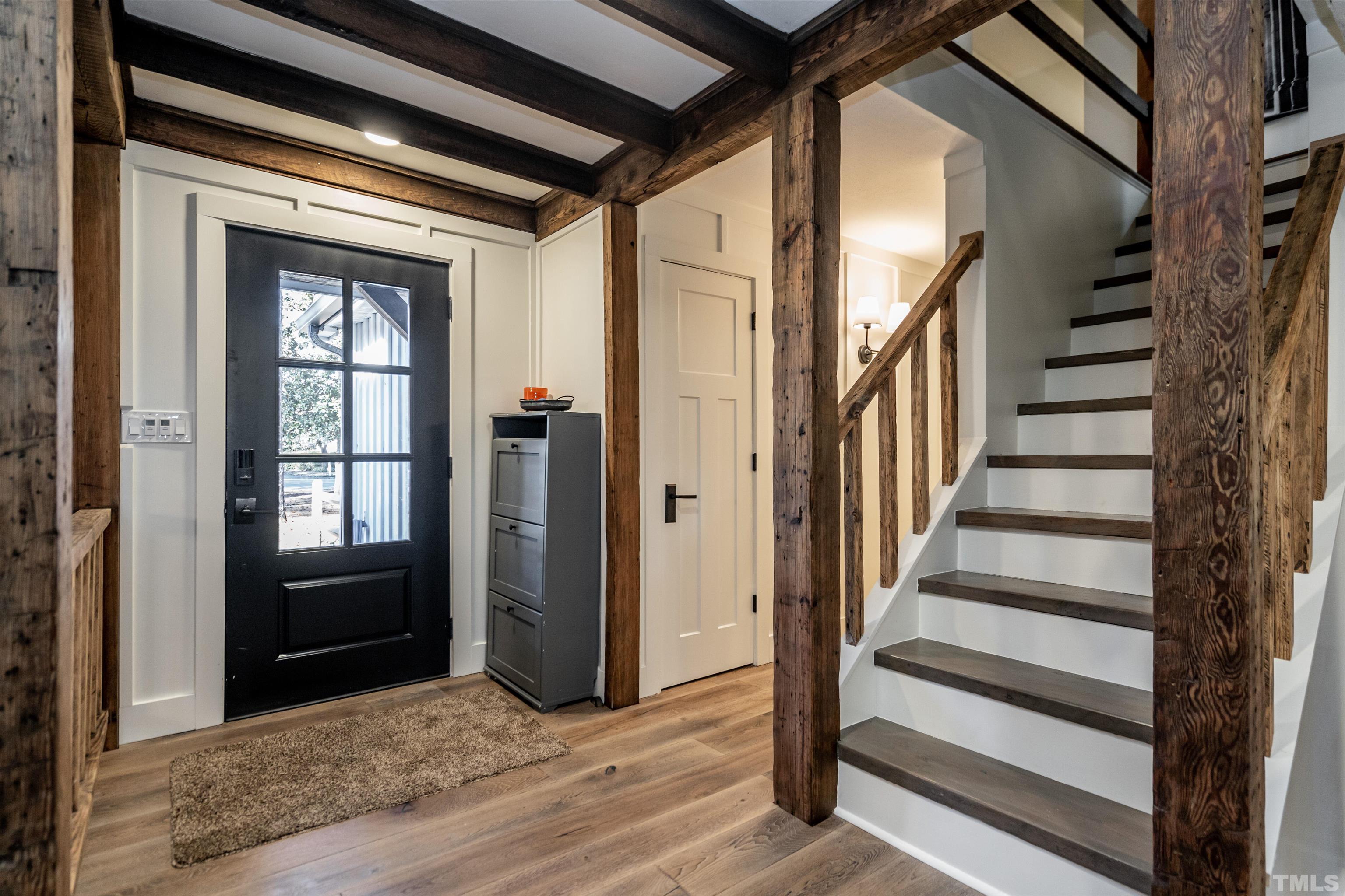 2412 Ridge Road Raleigh, NC 27612 - Photo 4 of 43 a view of entryway and hall with wooden floor