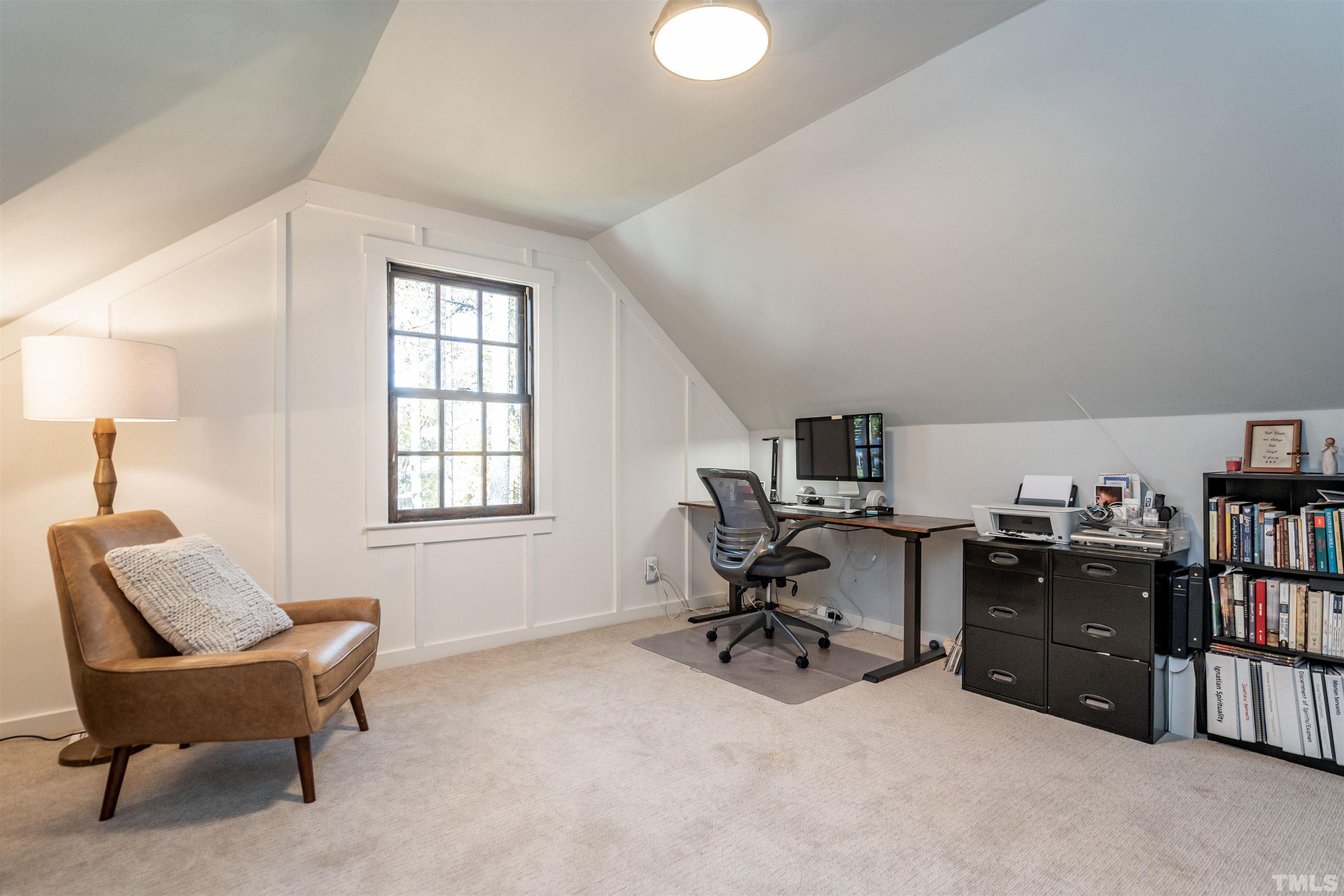 2412 Ridge Road Raleigh, NC 27612 - Photo 35 of 43 a view of a workspace with a window and lounge chair
