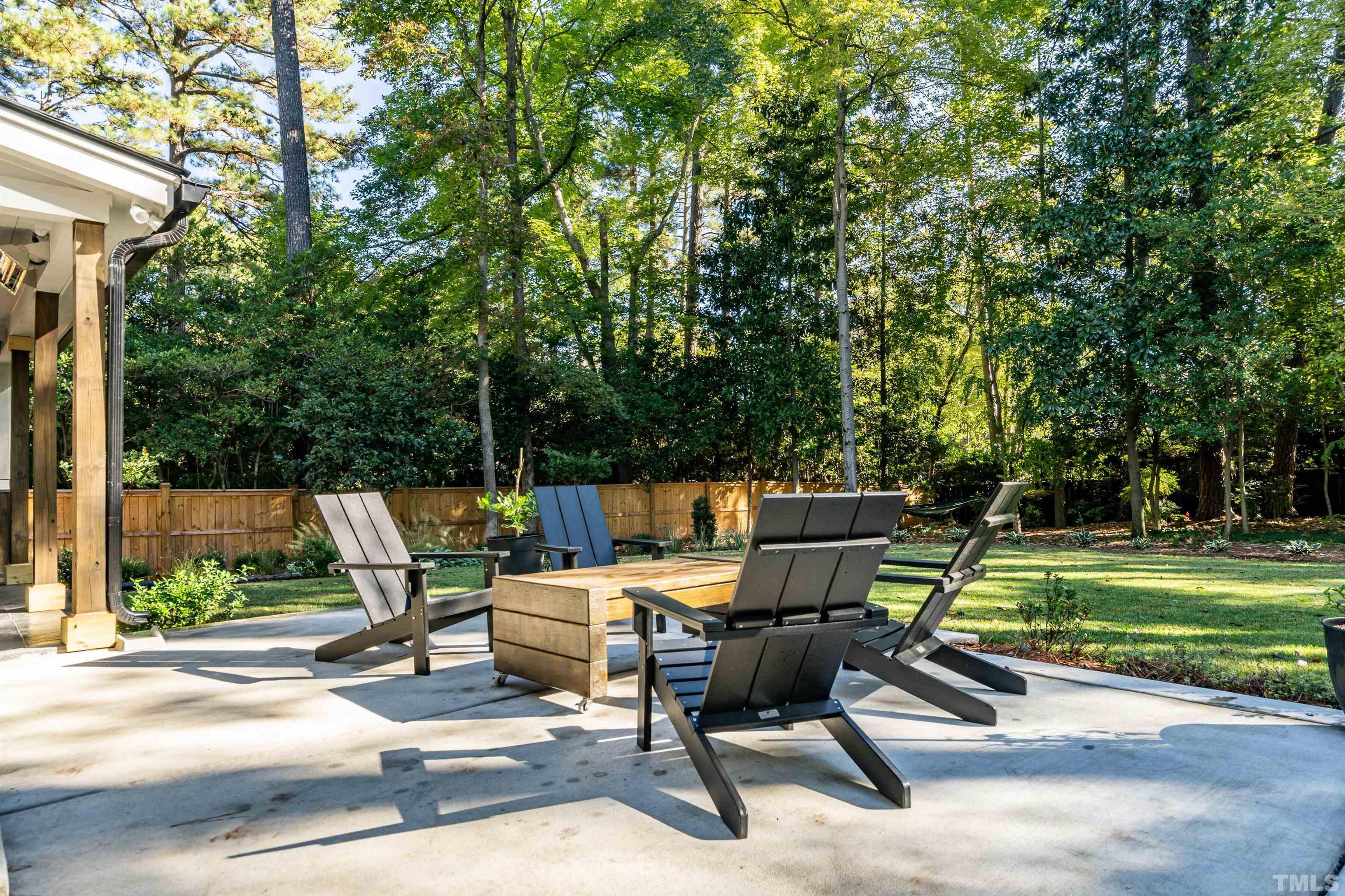 2412 Ridge Road Raleigh, NC 27612 - Photo 39 of 43 a view of backyard with a table and chairs
