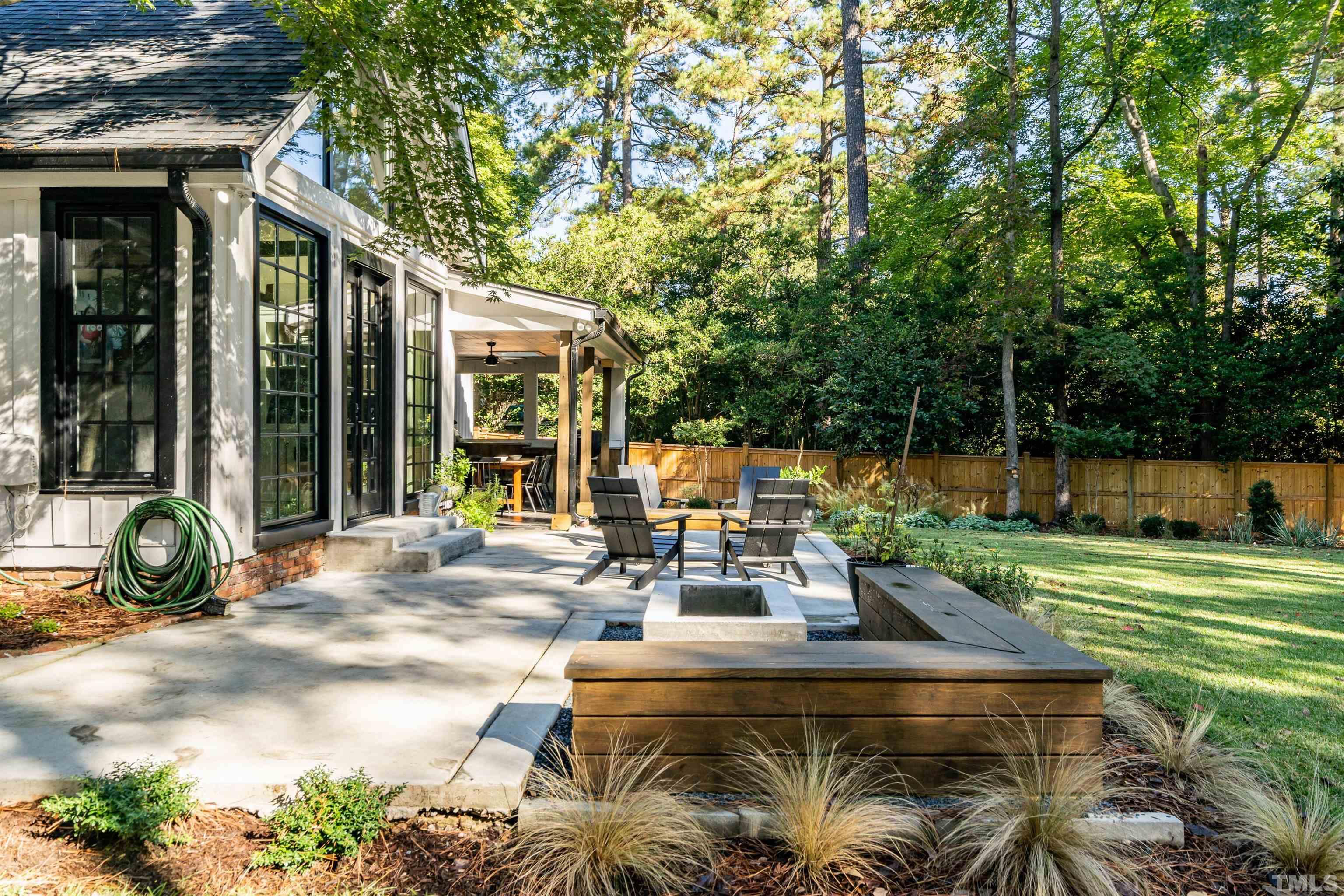 2412 Ridge Road Raleigh, NC 27612 - Photo 40 of 43 a view of a house with backyard and sitting area