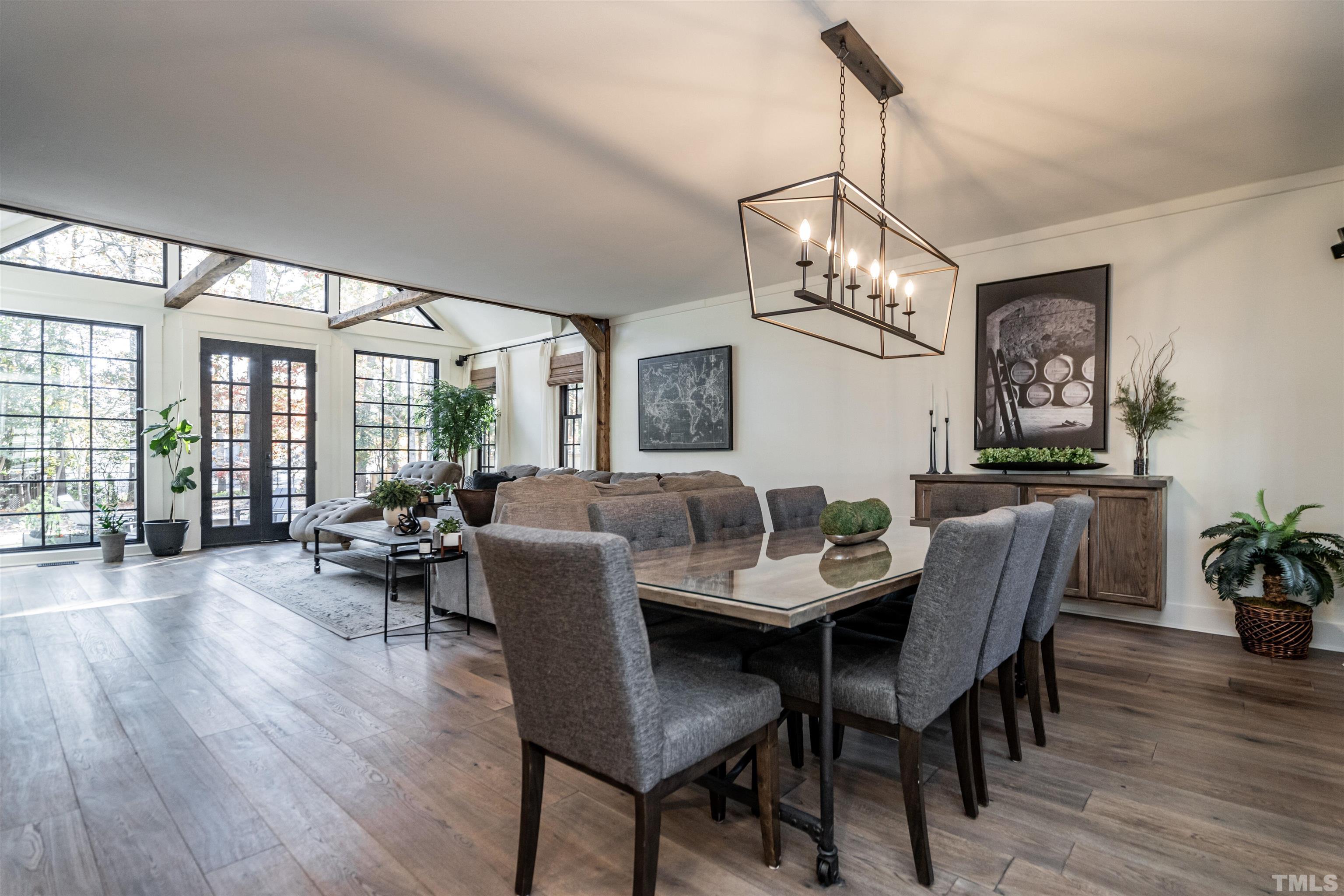 2412 Ridge Road Raleigh, NC 27612 - Photo 6 of 43 a view of a dining room with furniture wooden floor and chandelier