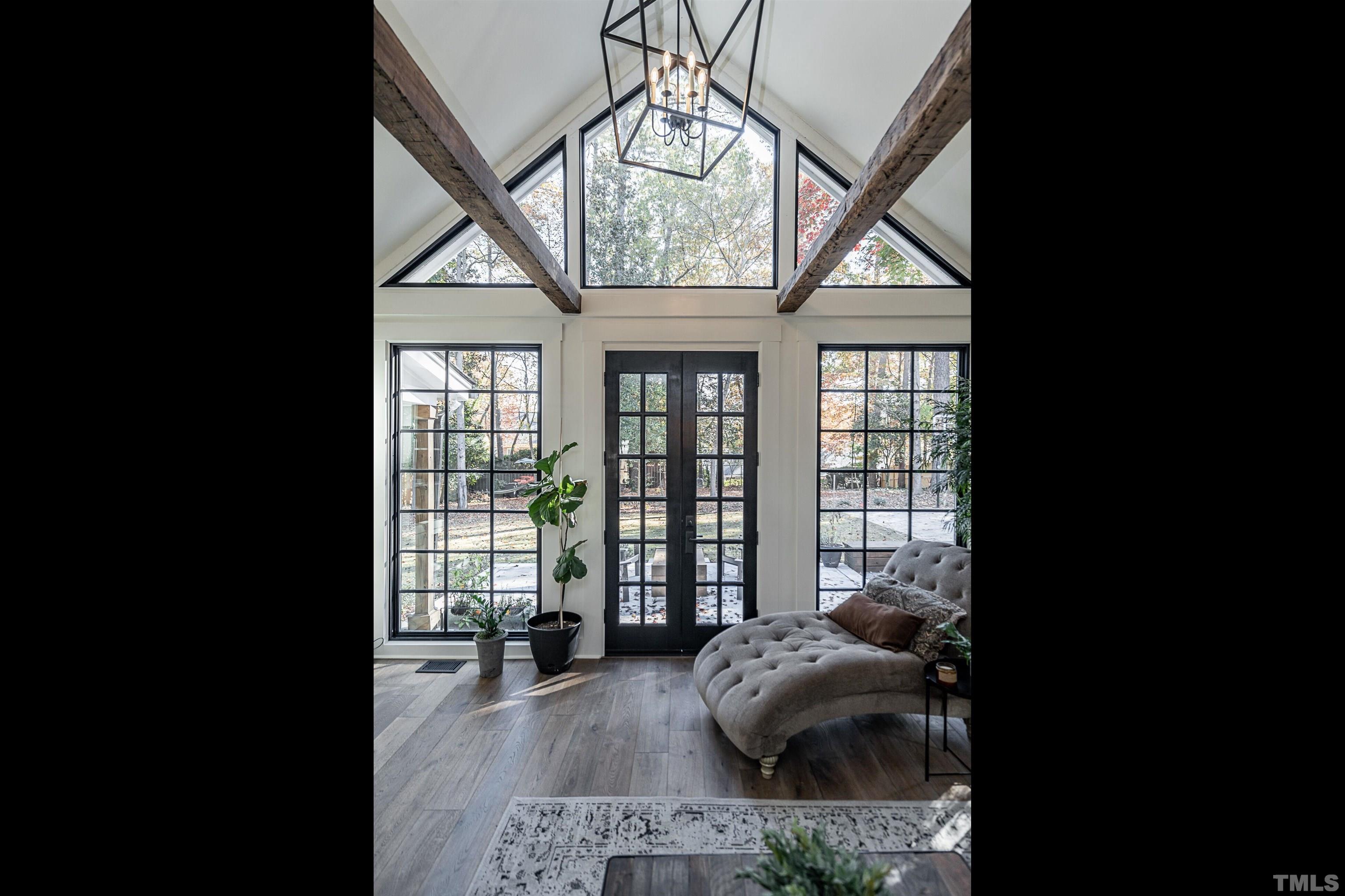2412 Ridge Road Raleigh, NC 27612 - Photo 9 of 43 a room with a bed and large windows