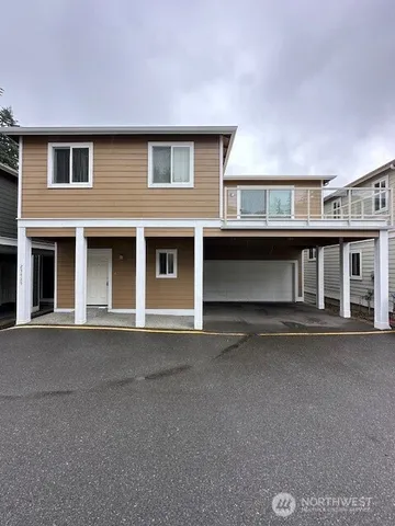 a front view of a house with yard