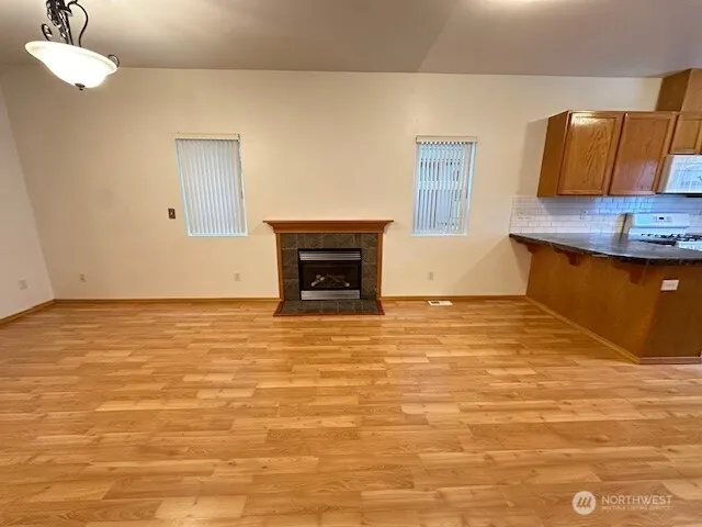 a view of a livingroom with wooden floor